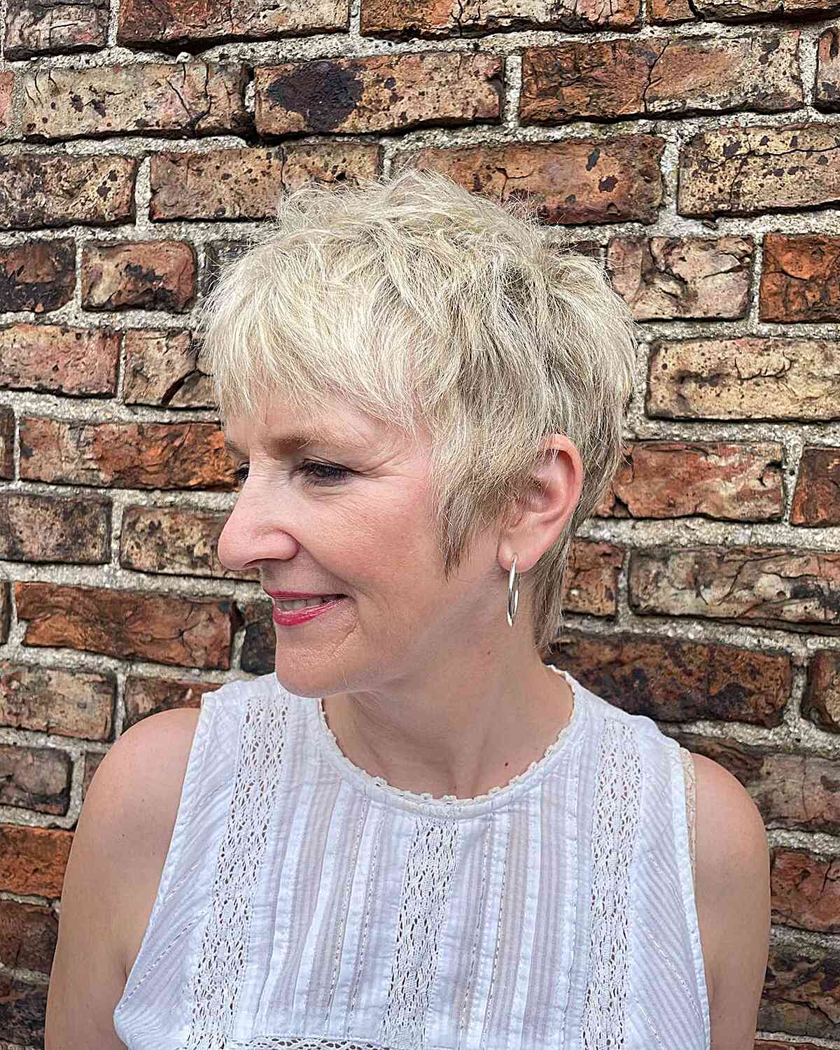 Blonde Razor Cut Pixie Shag with Bangs for Ladies Over 60