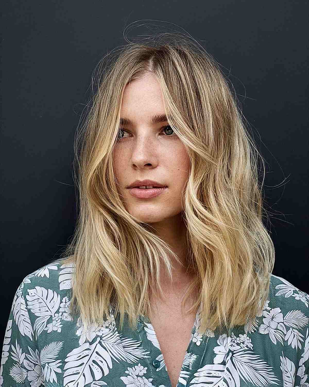 Blonde Shaggy Haircut with a Center Part for Fine Hair