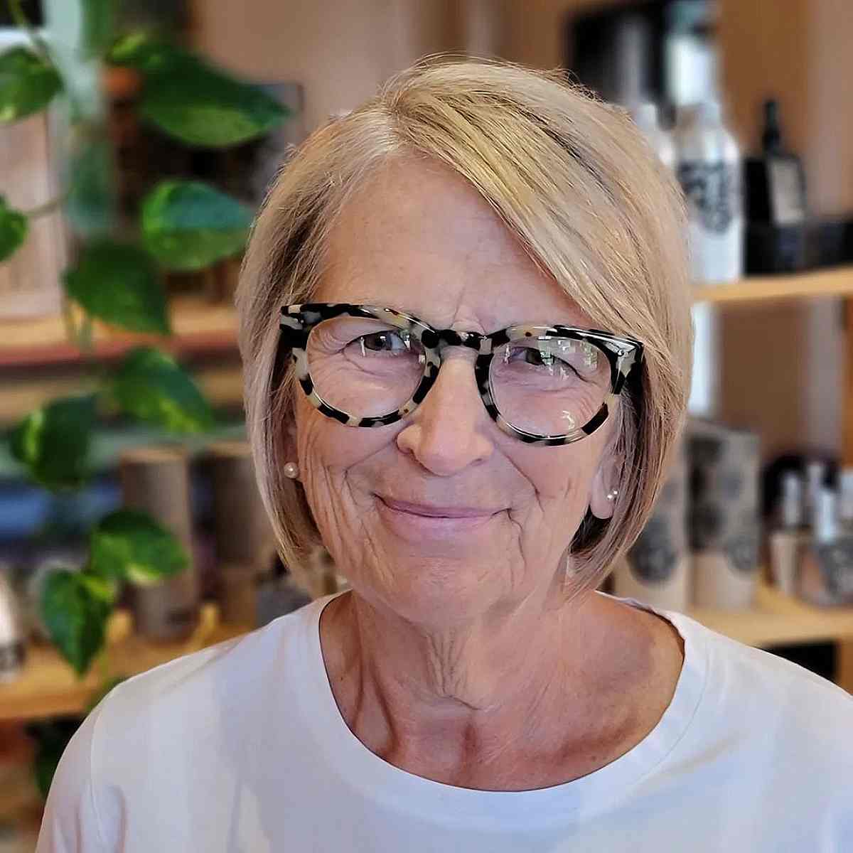 Blonde Short Cut with a Deep Side Part for 70-Year-Olds with Glasses