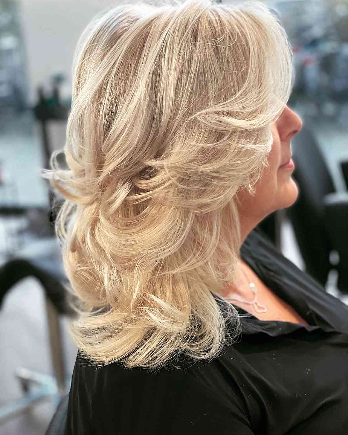 blonde shoulder-length feather layering