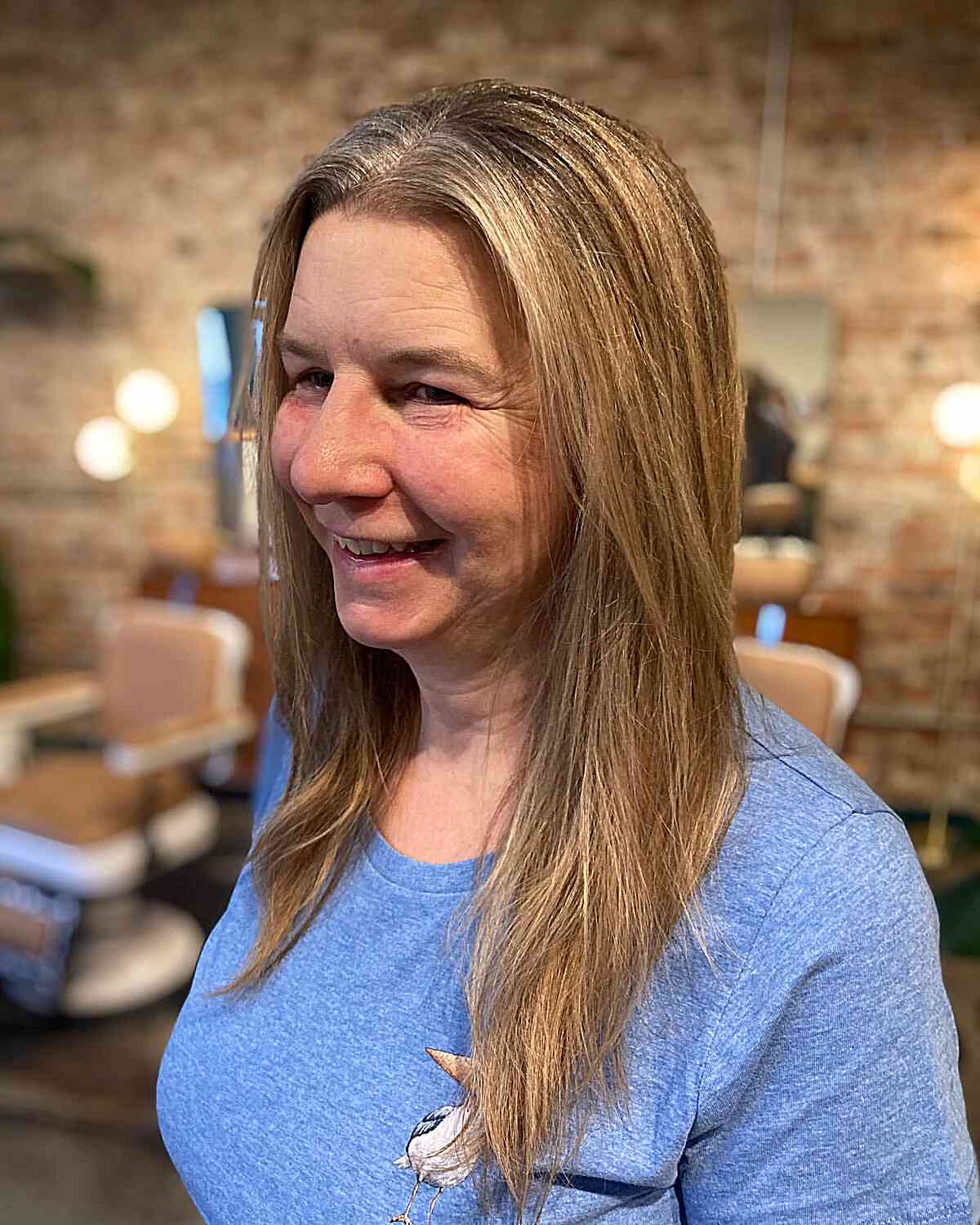 Mid-Long Blonde Straight Hair with Subtle Layers for Ladies in Their 60s