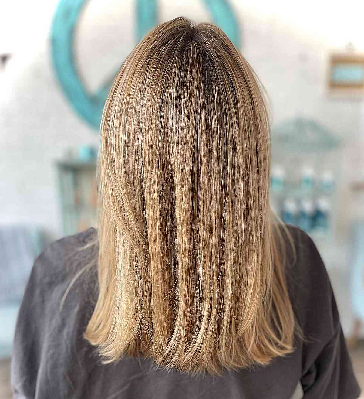 Medium-Length Blonde Straight Highlighted Hair with Honey Tones