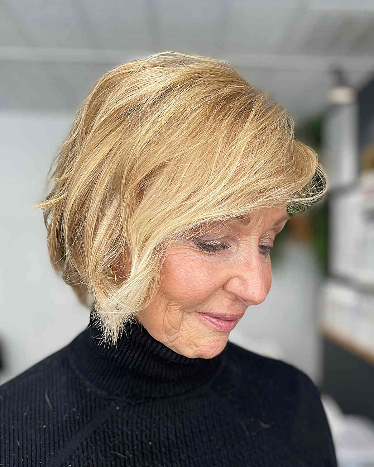 Chin-Length Golden Blonde Hair with Textured Choppy Bob Cut and Side Bangs