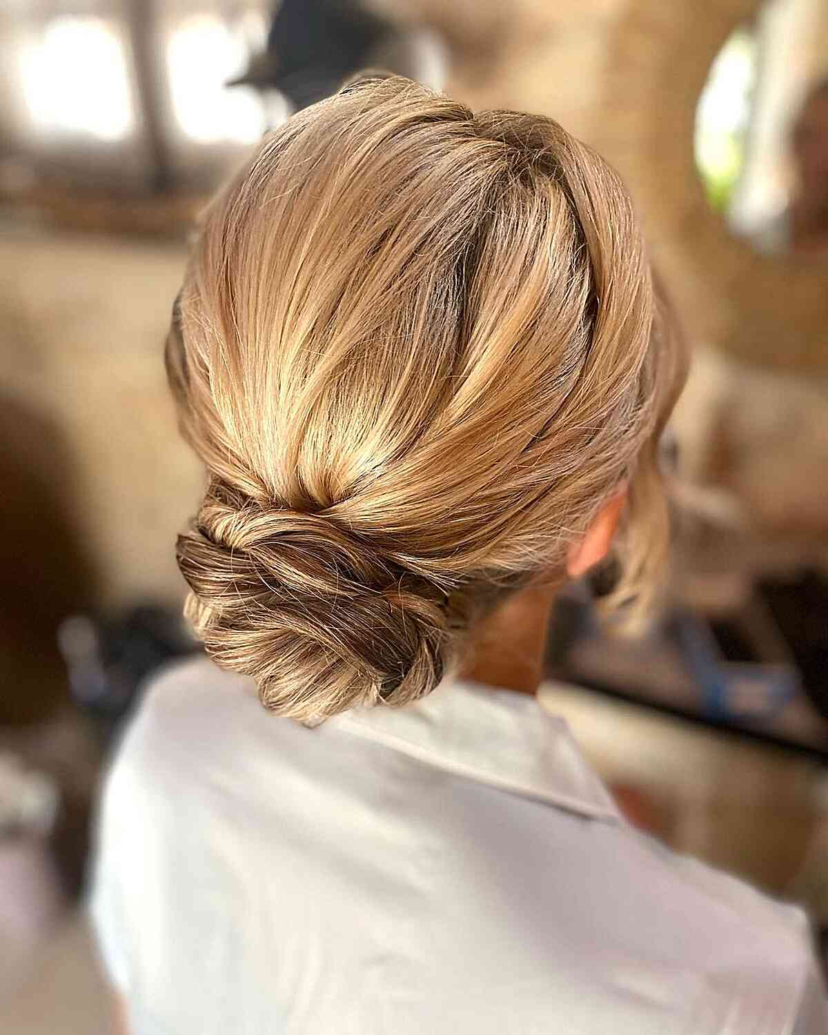Blonde Twisted Low Bun Wedding Guest Hairstyle
