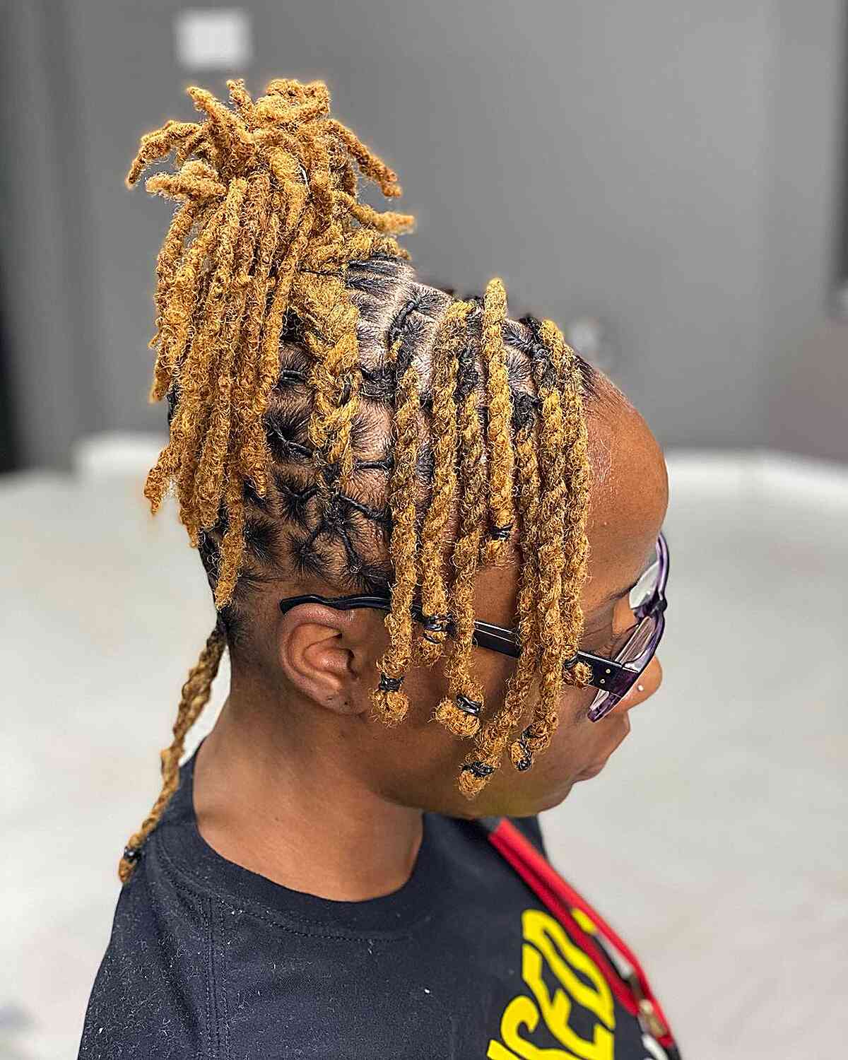 Medium Blonde Twists and Dreadlocks Updo with Side Bangs for Black Women