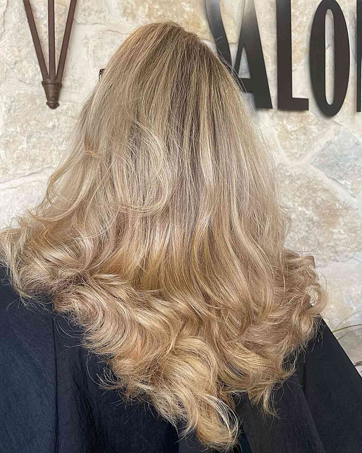 Blonde V-Cut with Feathered Layers on Thick-Haired Ladies