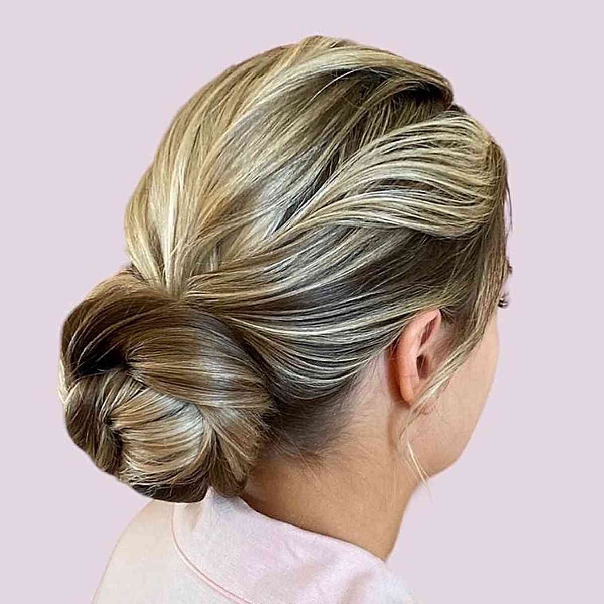 Brown-Blonde Low Textured Bun for Wedding Guest Hair Ideas