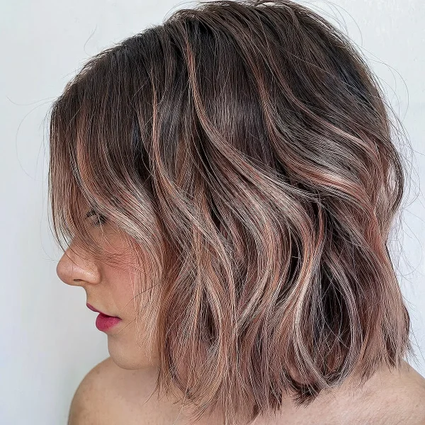 A blunt bob with rose gold highlights