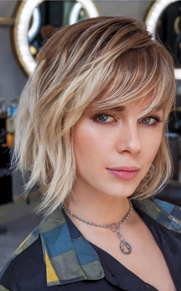 A Blunt bob with side swept bangs