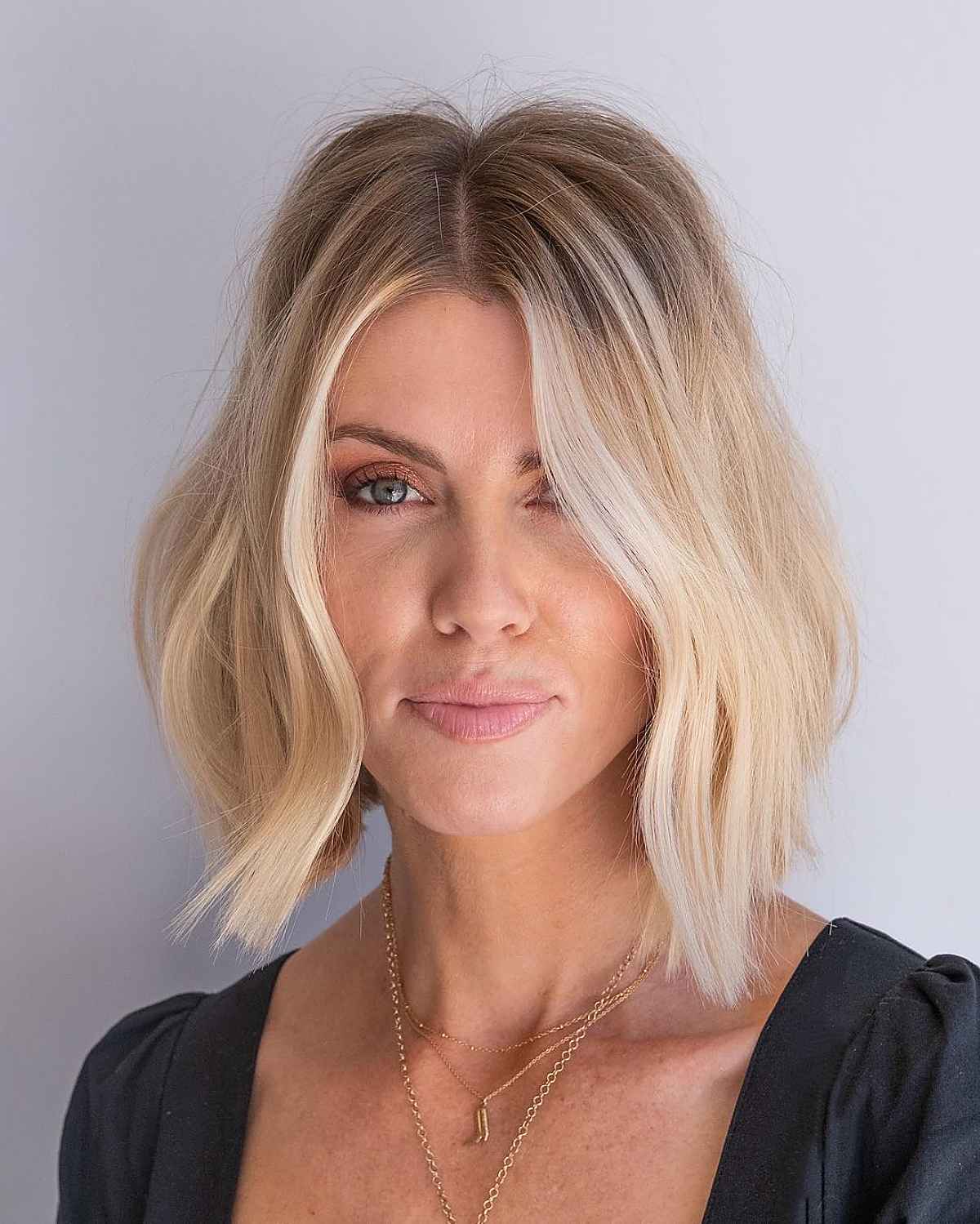 blunt cut with beach waves and a middle part