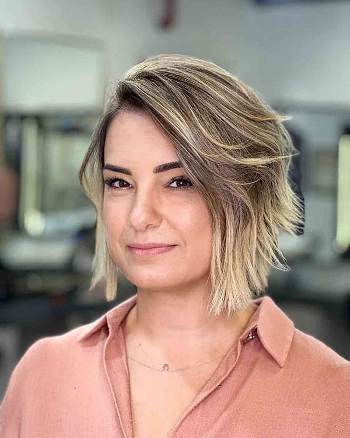 Blunt Dirty Blonde Balayage Bob with a Deep Side Part