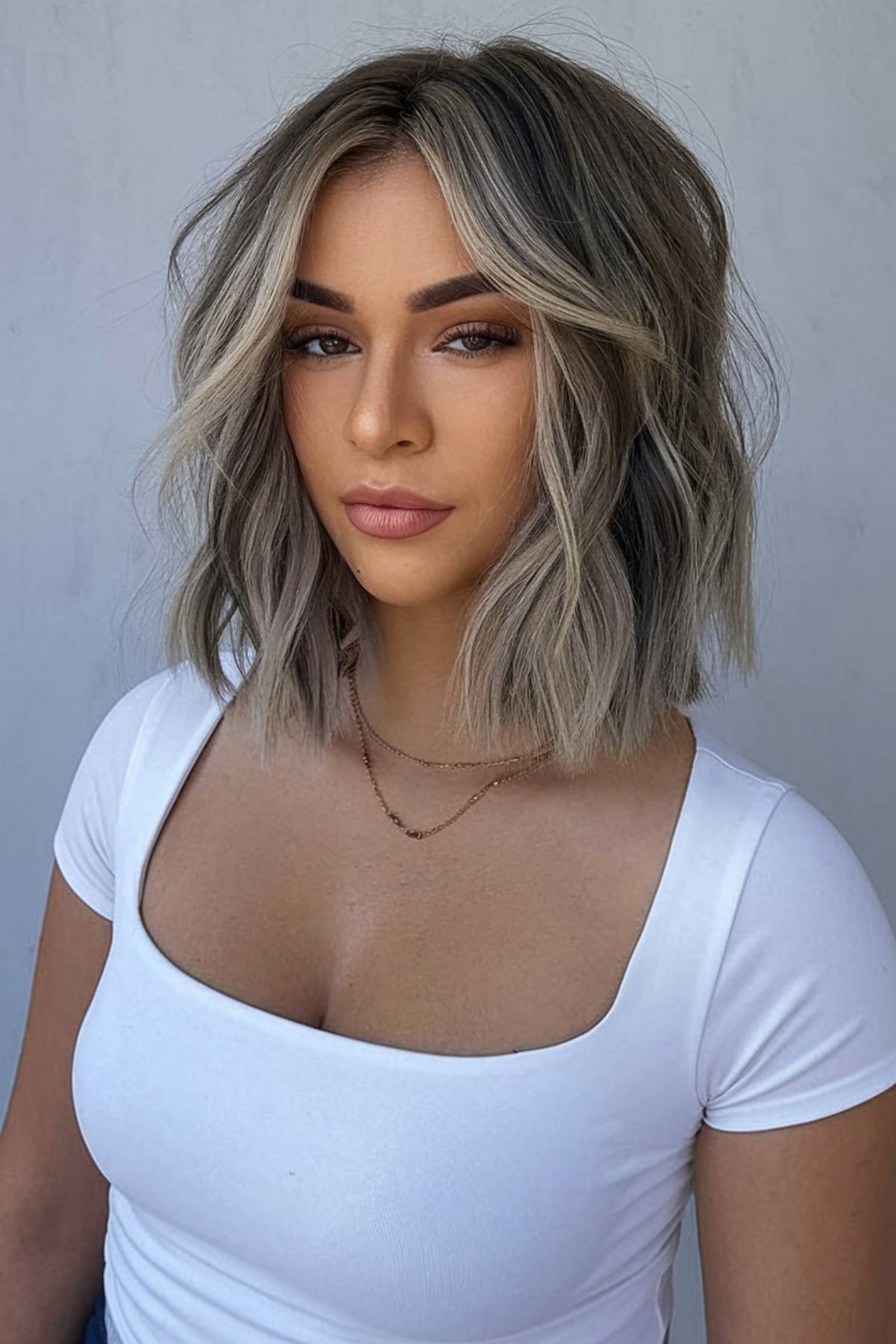 Bob haircut with shaggy layers and a middle part