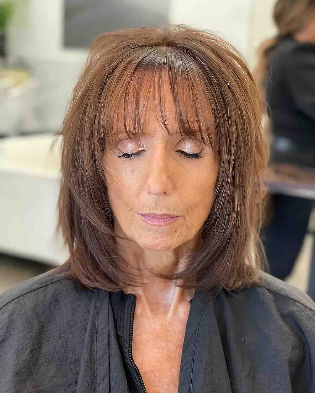 Bob with Face-Framing Layering and Bangs for Women Over 70