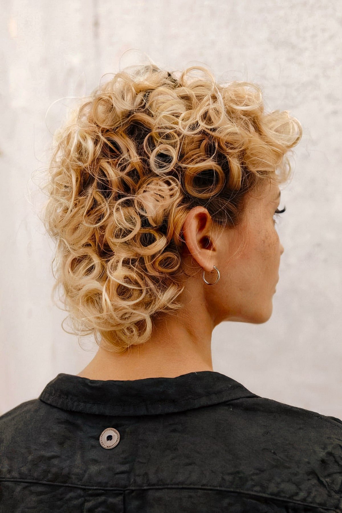 Curly mullet with undercut and voluminous curls