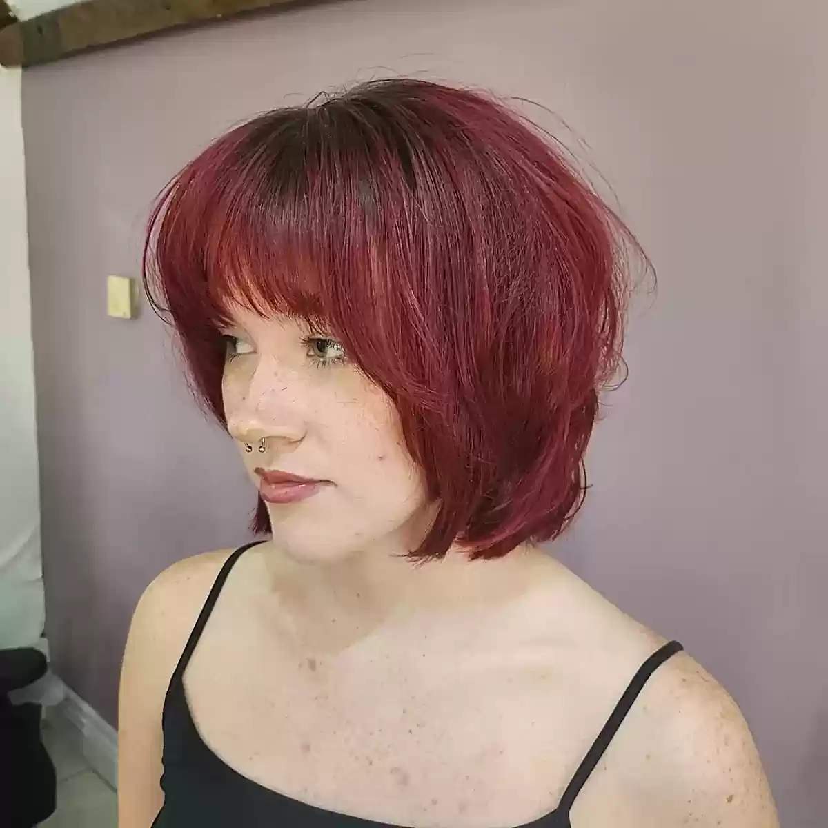 Bold Red Neck-Length Choppy Bob with Bangs and Texturized