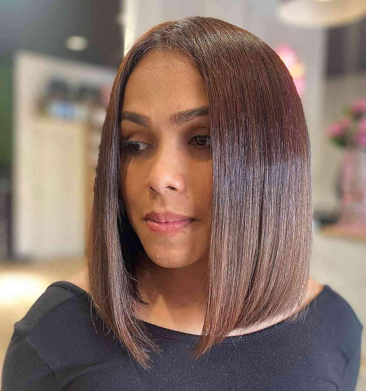 bold straight and sleek middle part bob style