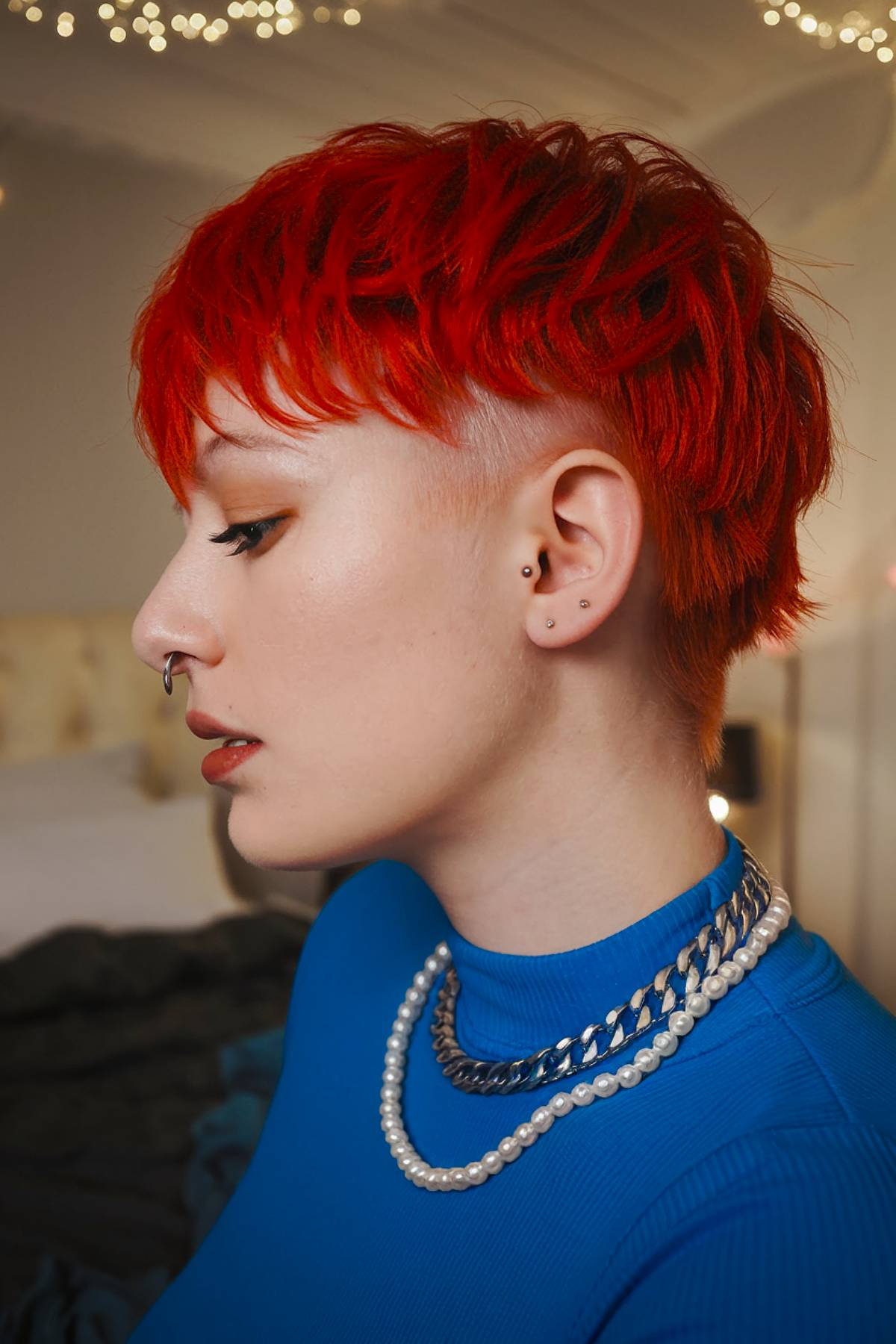 Bright red short emo haircut with undercut and textured layers