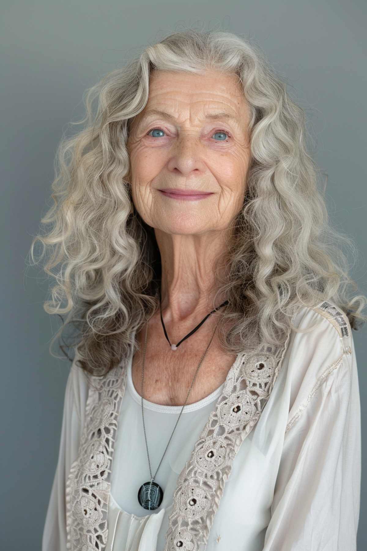 Bouncy mid-length grey curls on a woman