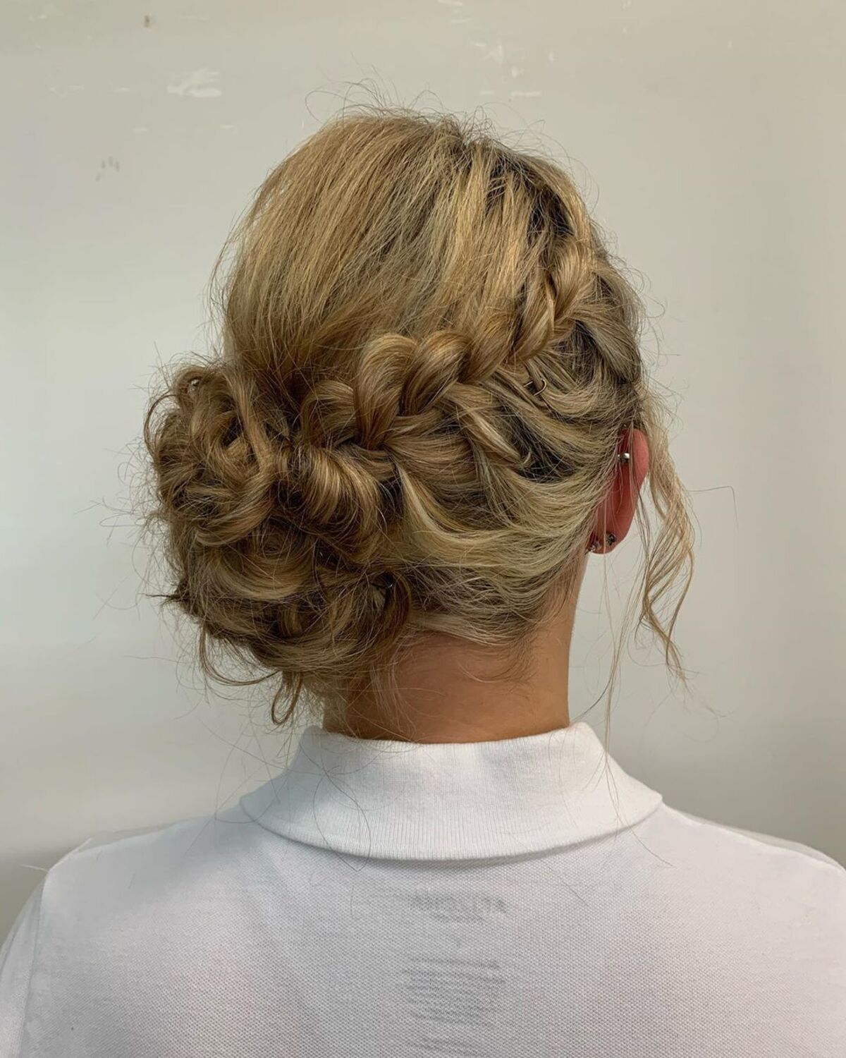 Braided Bun With Loose Side Braids Hairstyle