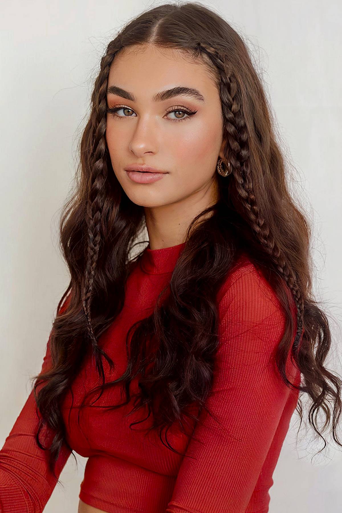 Long wavy hairstyle with braided face-framing tendrils