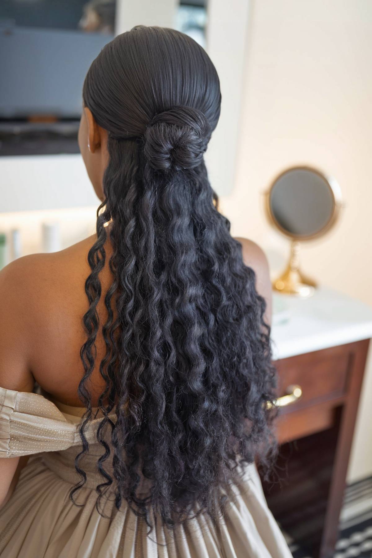 Bridesmaid half-up bun for natural curly hair