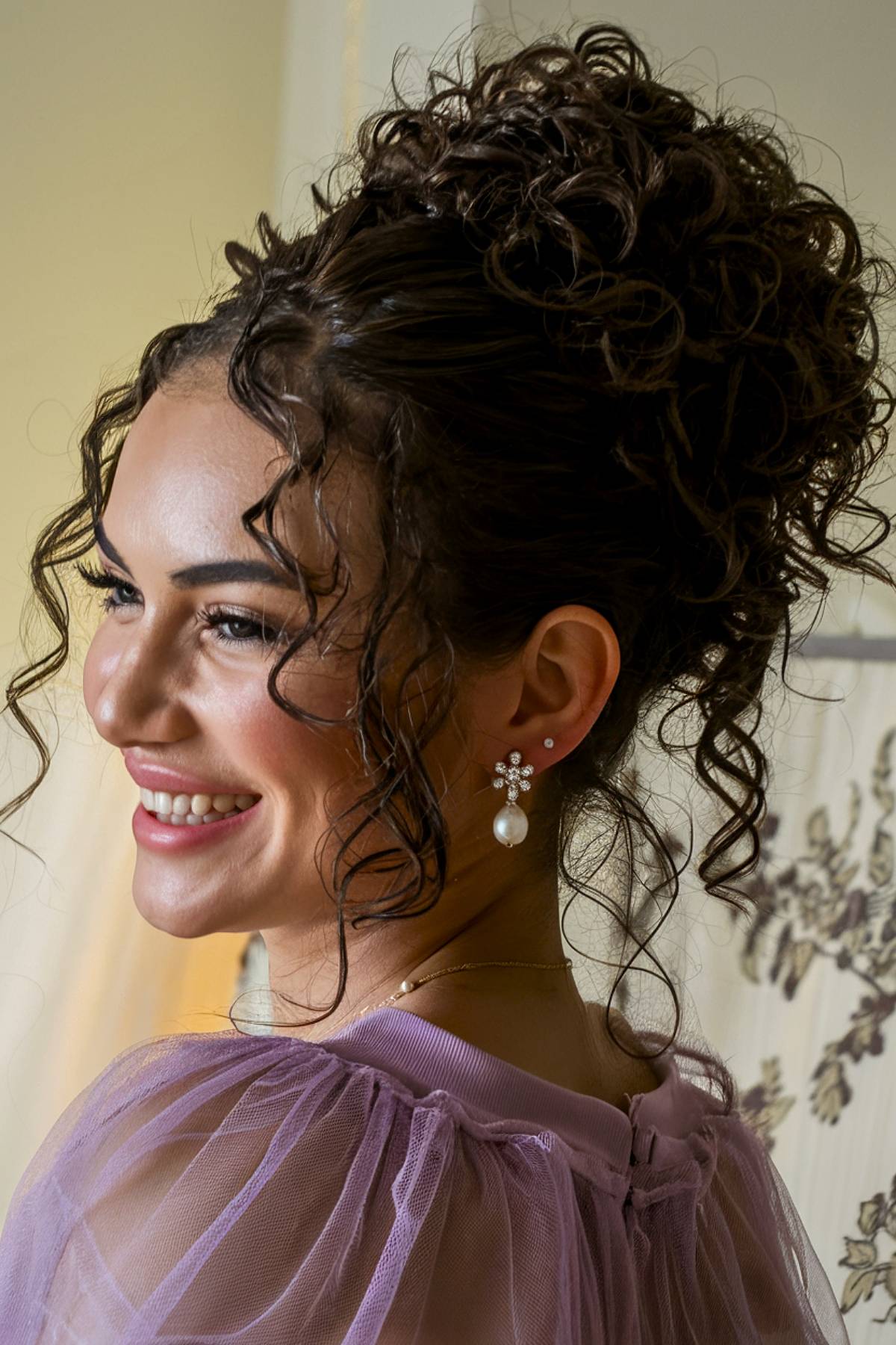 Bridesmaid updo hairstyle for curly hair