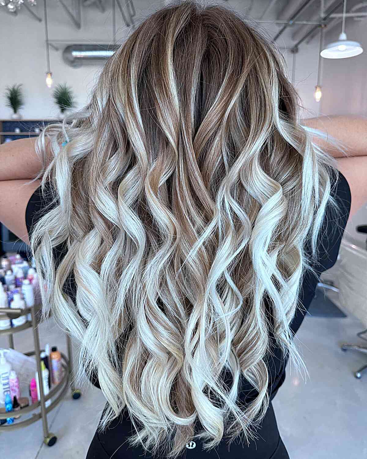 Bright and Gorgeous Blonde Balayage for women with long wavy hair