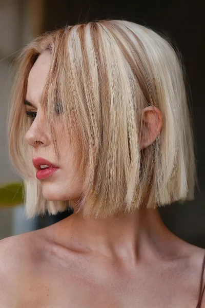 A bright blonde blunt cut hairstyle