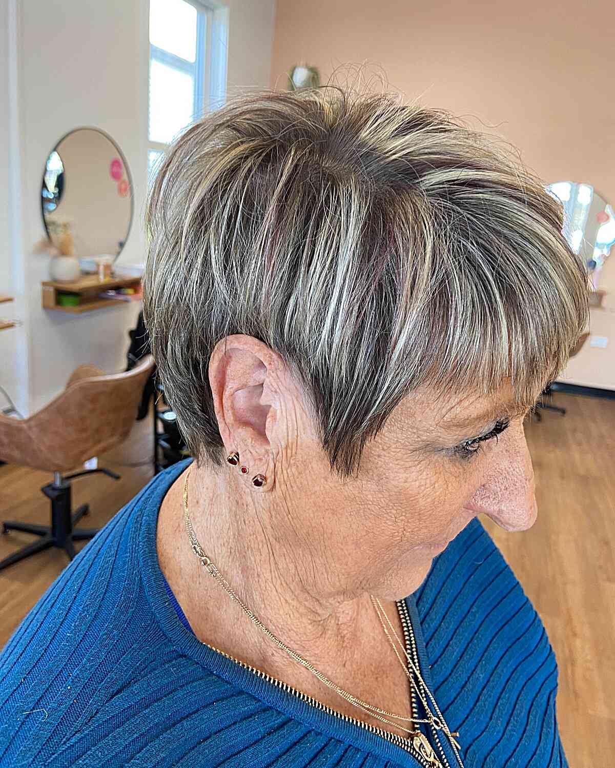 Bright Blonde Highlights on Short Dark-Colored Hair for 60-Year-Old Ladies