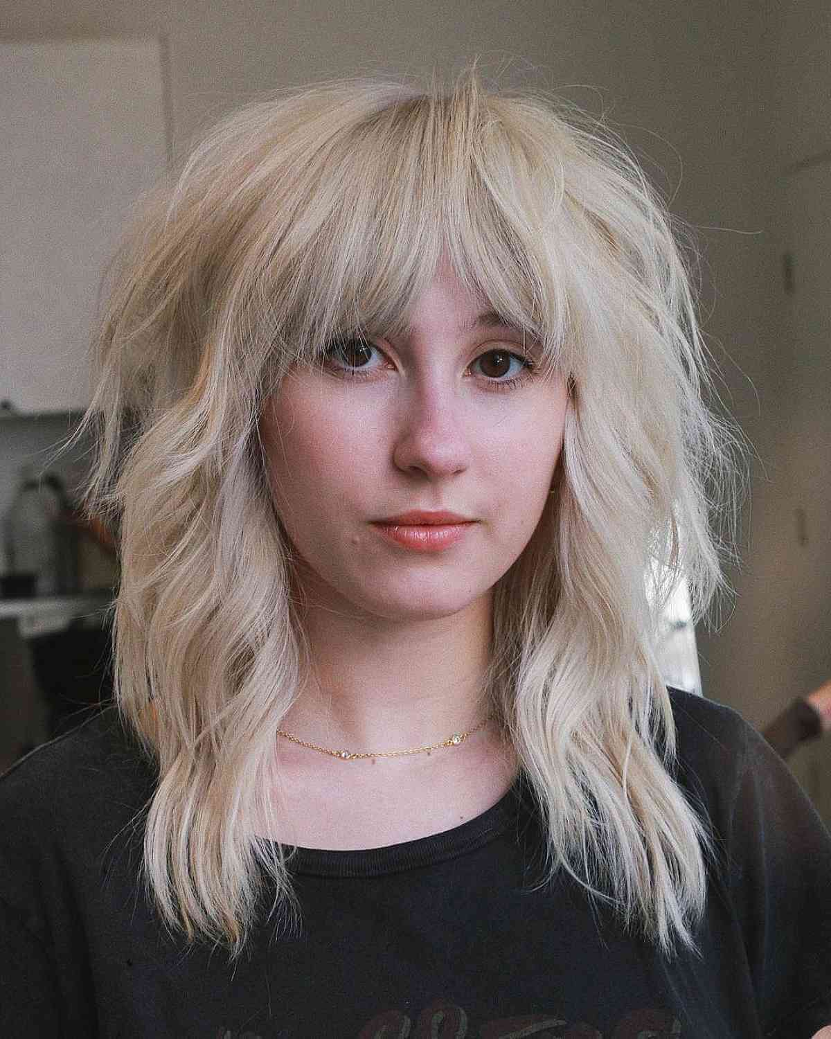 Bright Blonde Layered Wolf Cut with Bangs