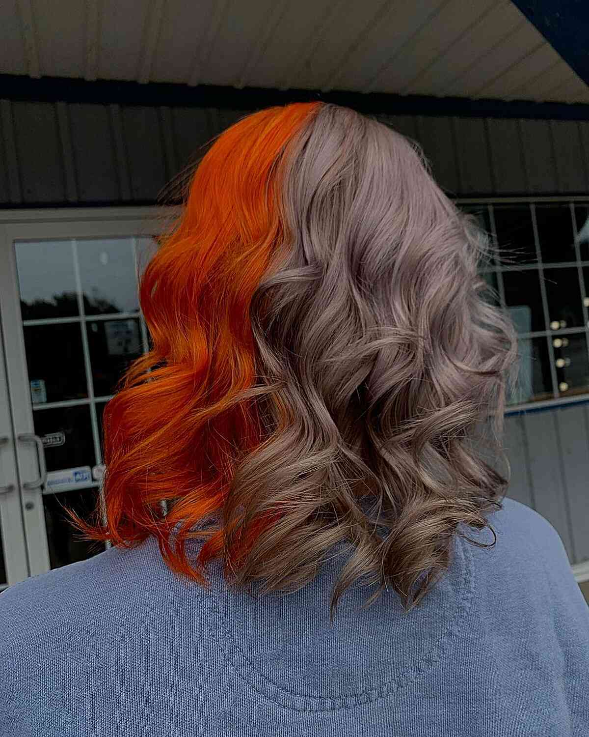 Bright Orange and Mushroom Silver Split Dye on Shoulder-Length Hair