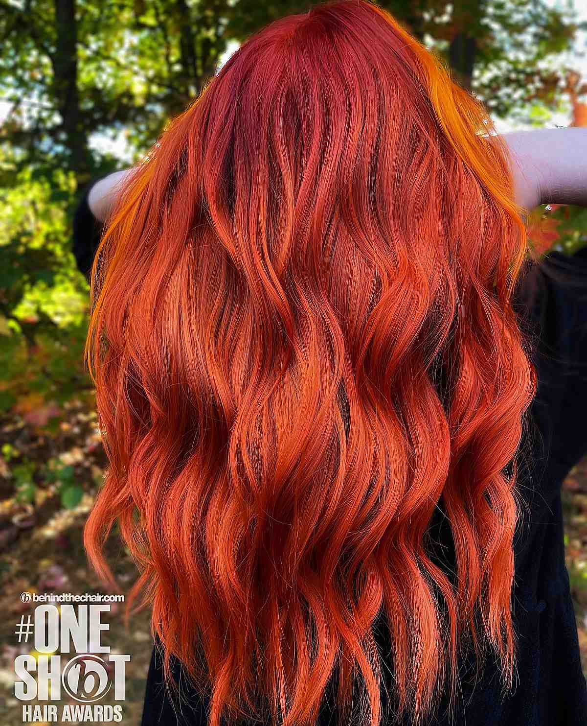 bright red long hair with an orange money piece