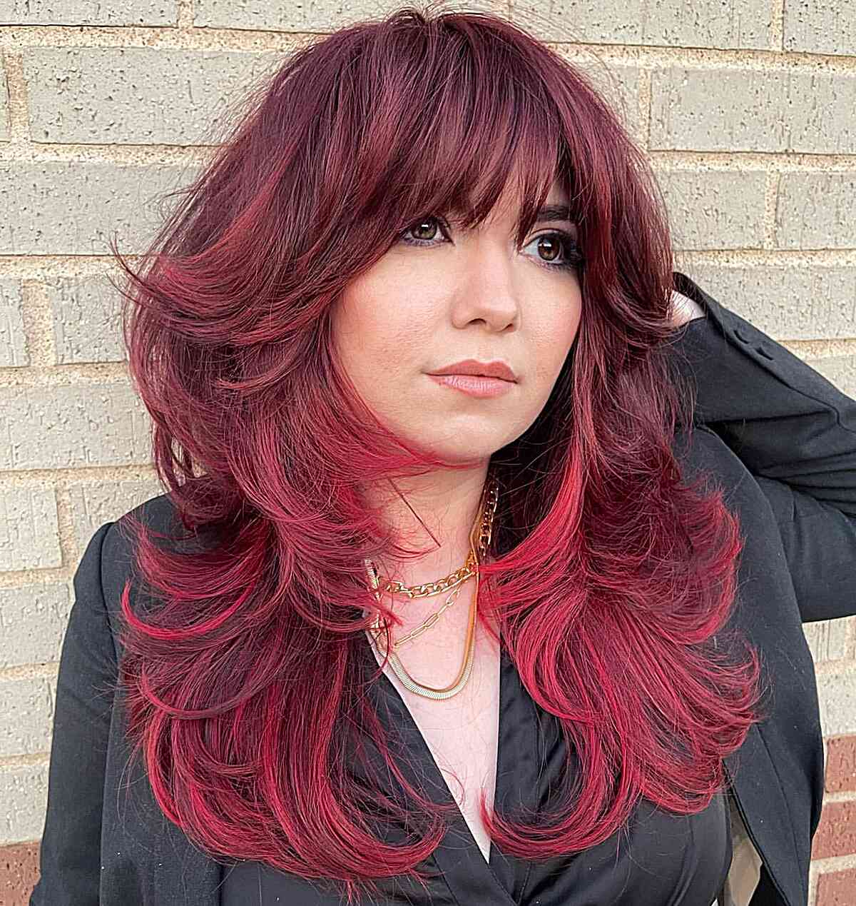Bright Red Long Shag with Layers and Bangs for Rounder Face Shapes and Medium-Length Hair