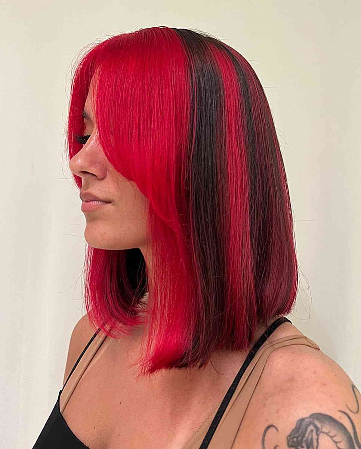 Bright Red Reverse Skunk Stripe Hair with Long Bob Cut