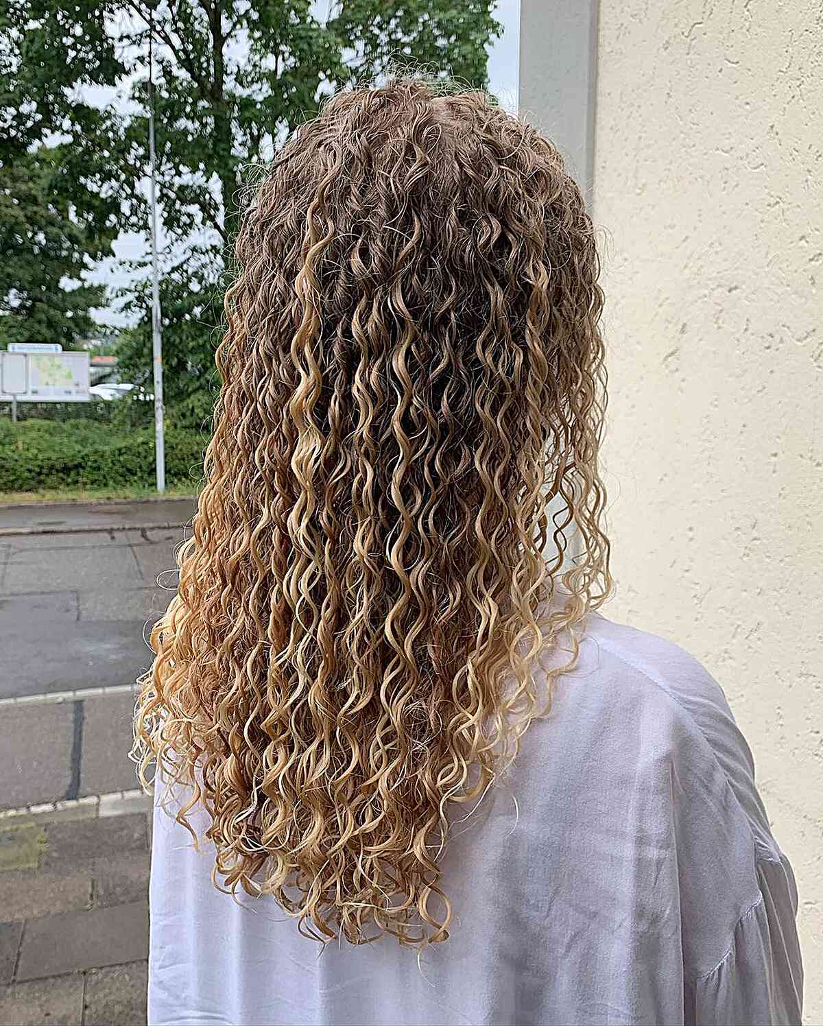 Long Brown-Blonde Ombre Hair with Spiral Perm
