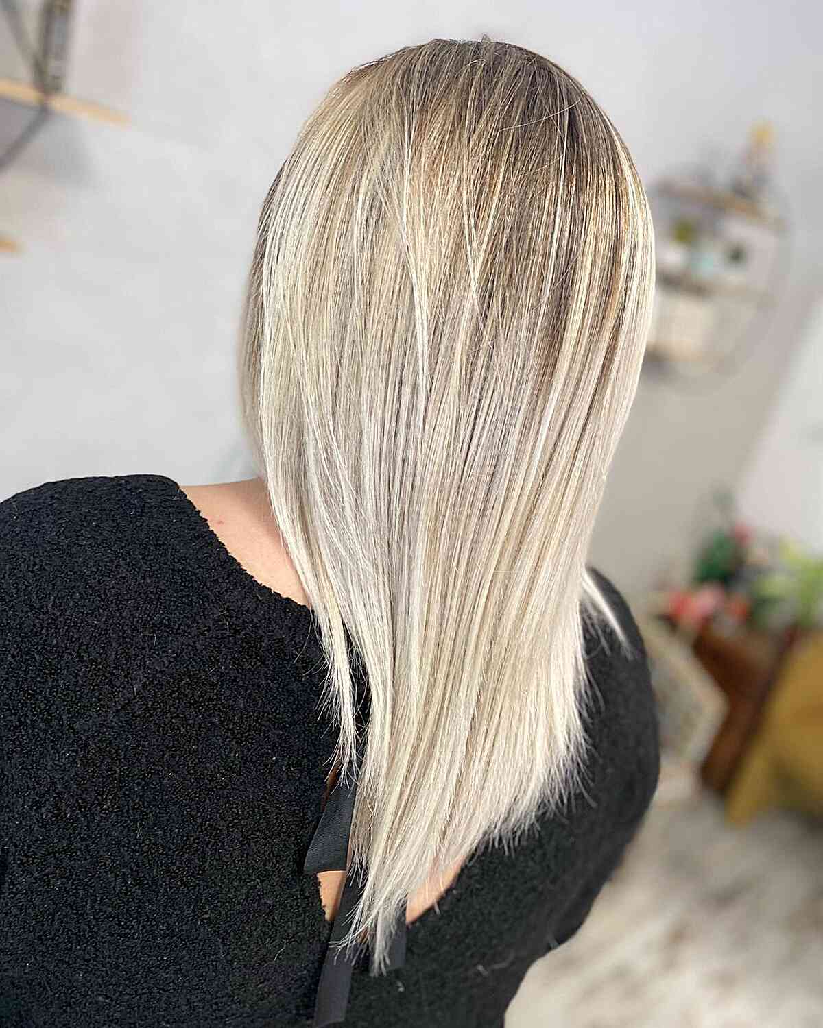 Brown-Rooted Champagne Blonde Balayage with Medium Straight Layers