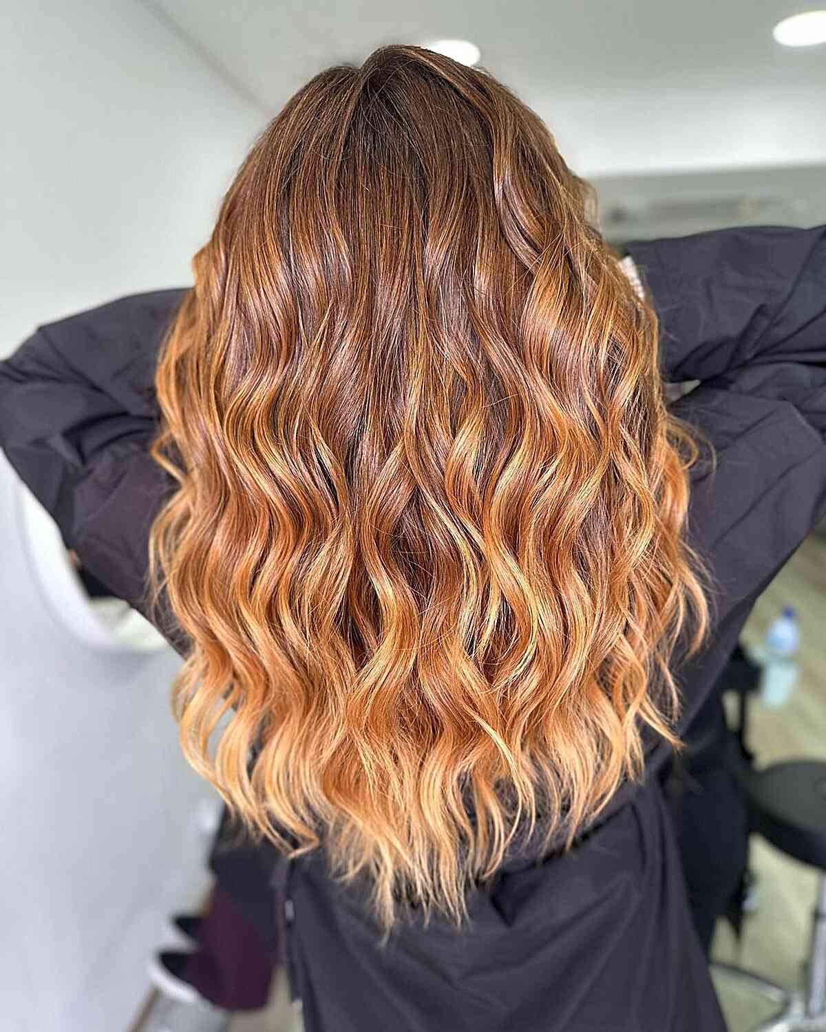 Brown to Golden Blonde Ombre on women with long wavy hair