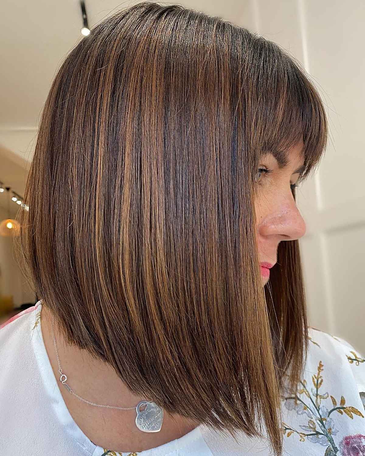Brunette A-line Lob Cut with Arched Bangs