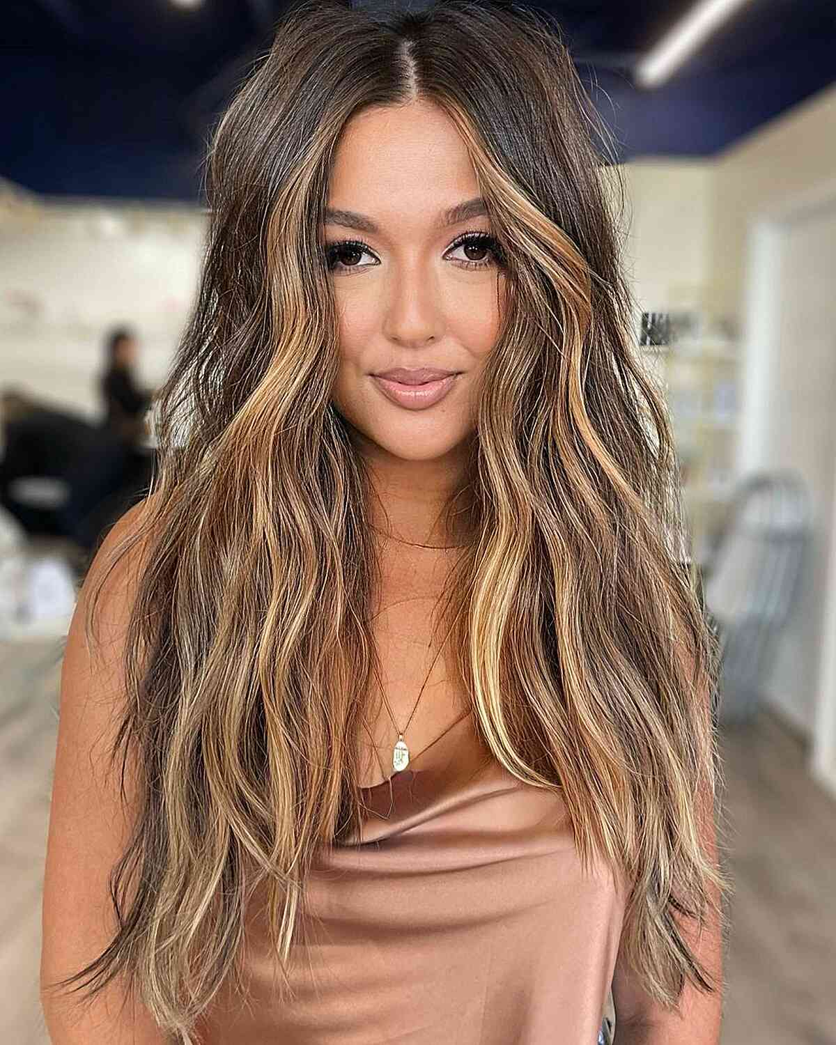 Very Long Wavy Brunette Hair with Warm Blonde Face-Framing Highlights