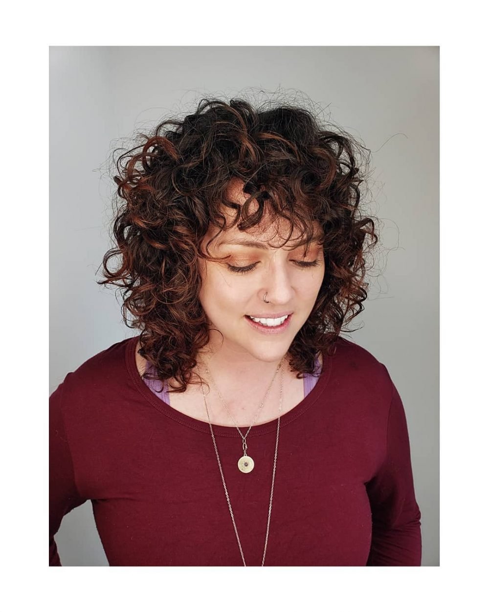 Brunette Curly Bob with Bangs and Layers