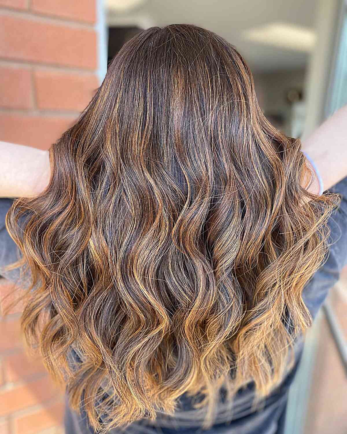 Brunette Hair with Light Caramel Balayage Tones for Medium to Long Waves