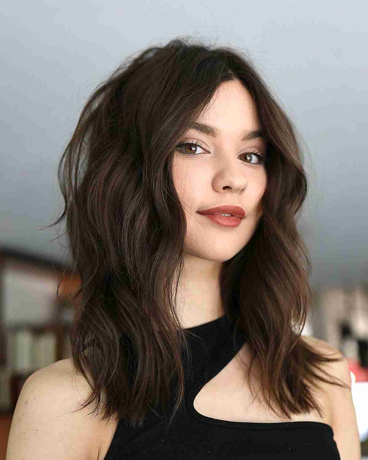 Classic Brunette Hairstyle with a Deep Side Part