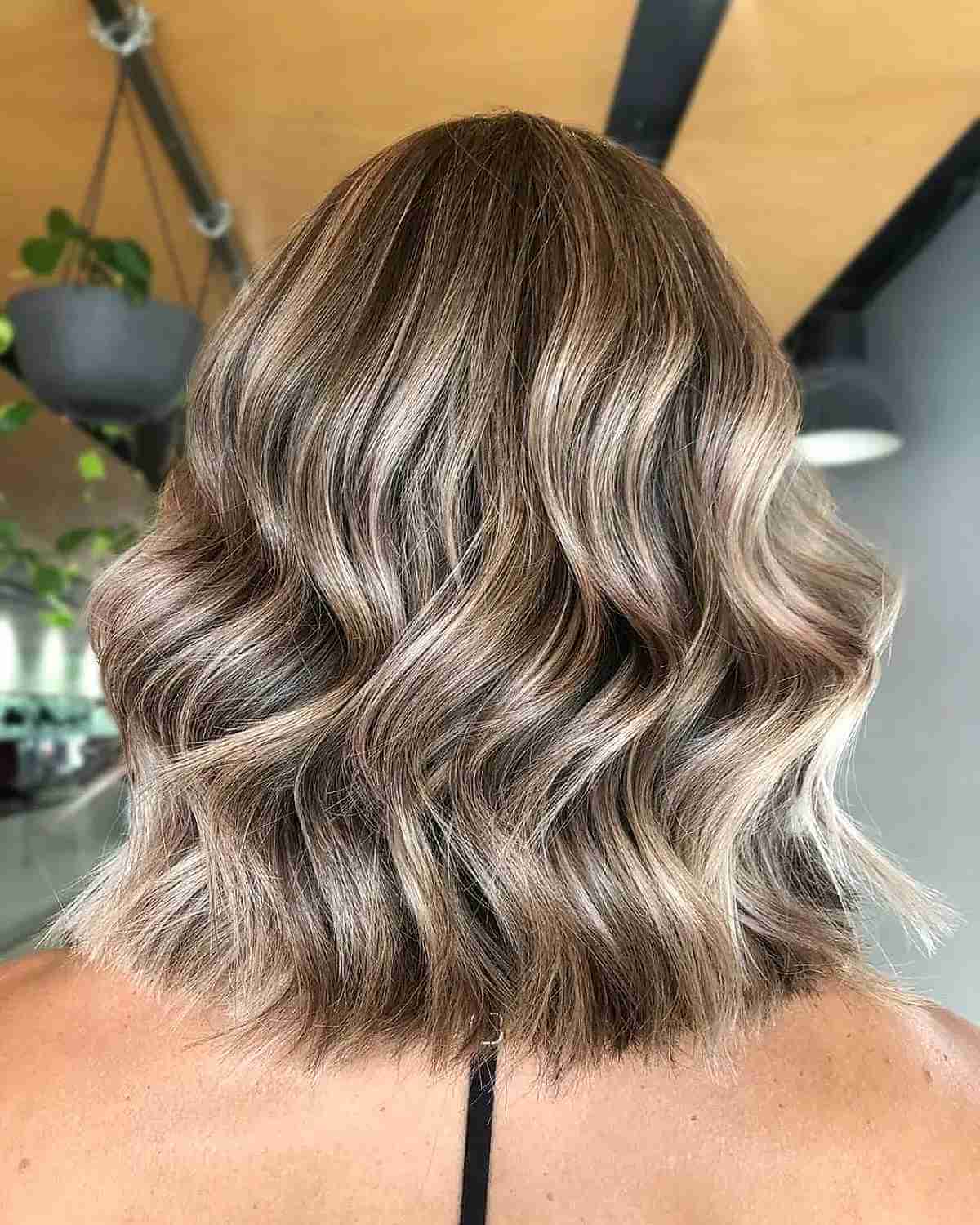 Brunette Lob with Glossy Blonde Highlights