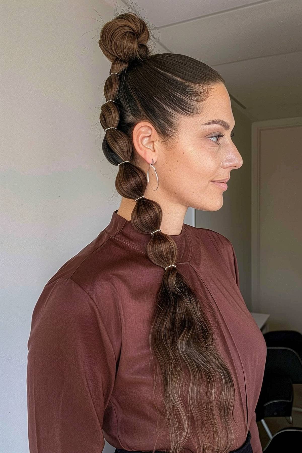 Sleek and smooth bubble braids ponytail offering a polished and versatile look for straight hair.