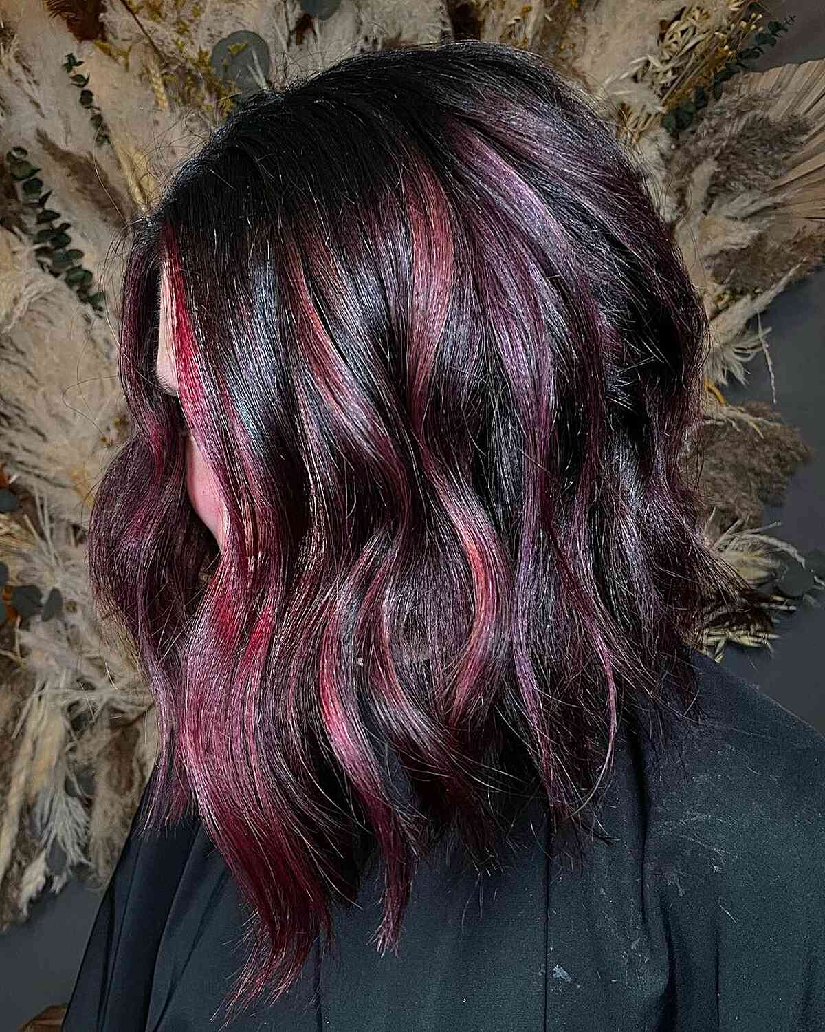 Burgundy Cherry Highlights on Dark-Haired Women with Angled Long Bob Cut