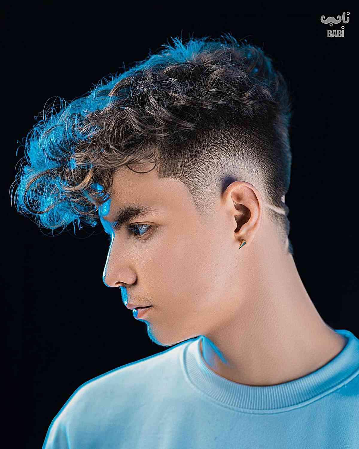 Burst Taper Fade with Textured Curls on Young Men