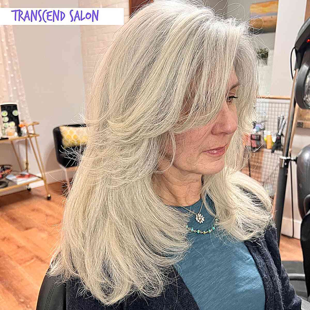 Mid-Length Butterfly Layered Feathered Hair with Side Bangs for Older Women with Grey Hair