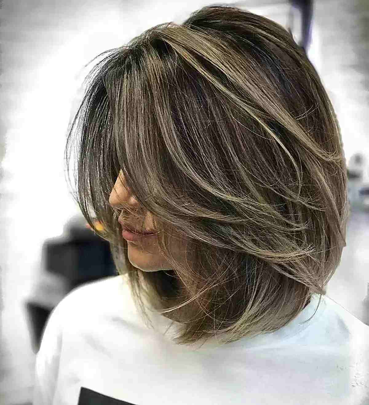 Butterfly Lob Cut with Longer Layers and Blonde Highlights