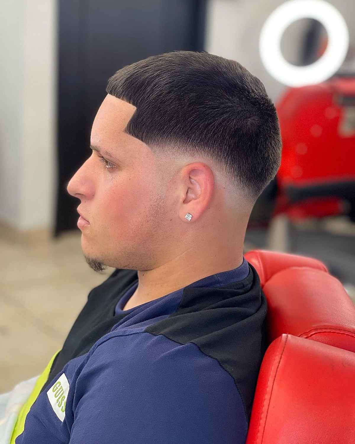 Clean caesar haircut with low fade for dudes