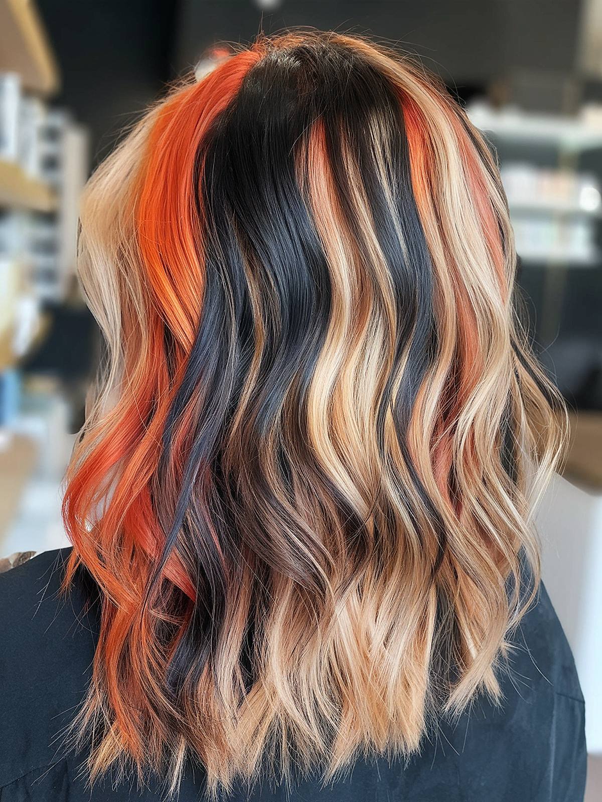 Calico hair color with orange blonde and black streaks